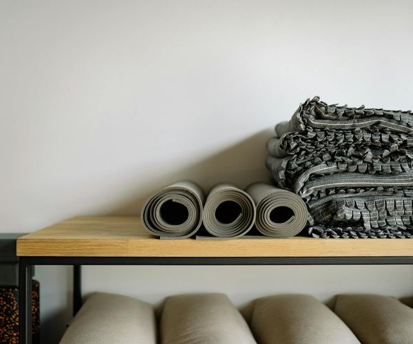 A calm and minimalist yoga studio interior with soft lighting.